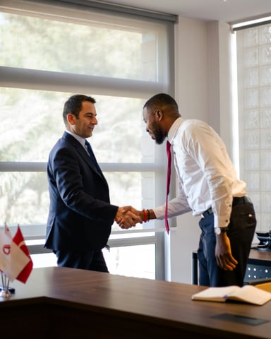 Two professionals shaking hands in a bright office