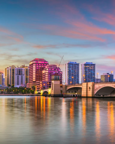 West Palm Beach skyline at dusk reflected on the Intracoastal Waterway