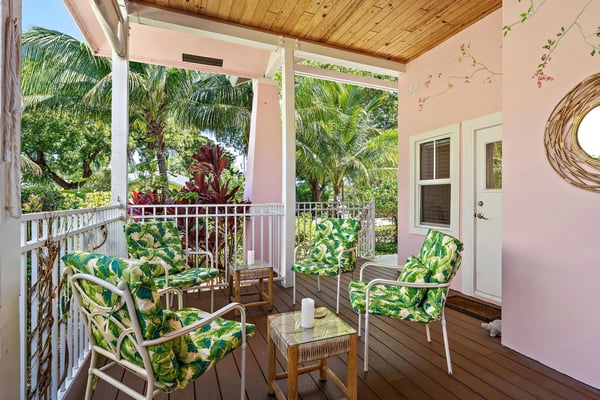Guests relaxing by a pool at a Palm Beach vacation rental